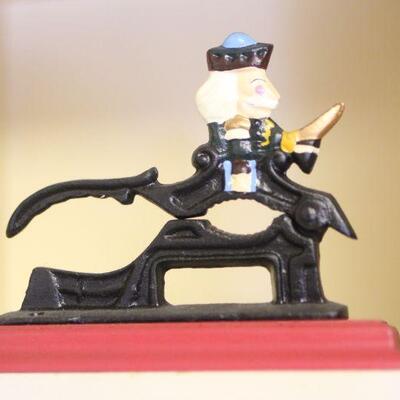 Lot 86 Cast-iron Nutcracker, Doll and Figurine
