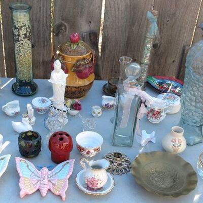 Assorted glass and ceramic decorative items.