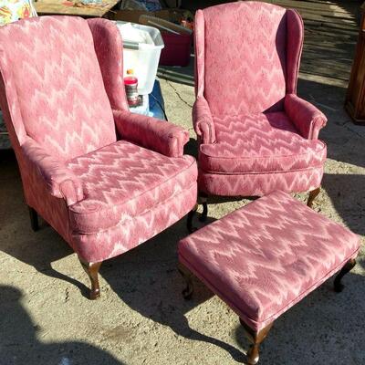 Pair of upholstered fabric chairs and single ottoman.