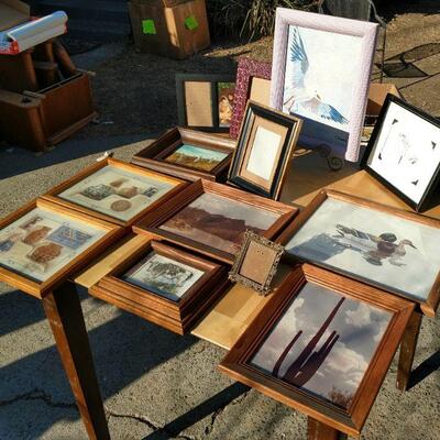 Assorted framed artwork.