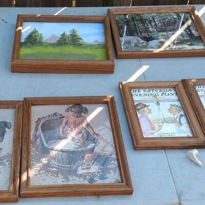 Assorted framed artwork.