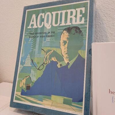 Lot 675: Vintage AQUIRE New Board Game + Dad Book