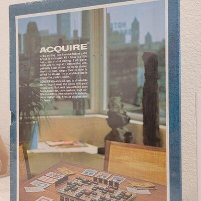 Lot 675: Vintage AQUIRE New Board Game + Dad Book