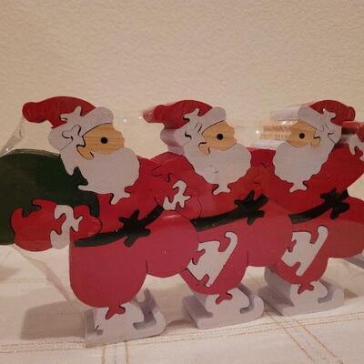 Lot 704: Christmas Treasures Music Box and Santa Claus Puzzle 