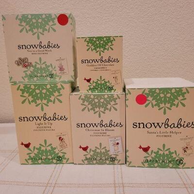 Lot 713: Assorted Dept 56 Snowbabies Christmas Figures 