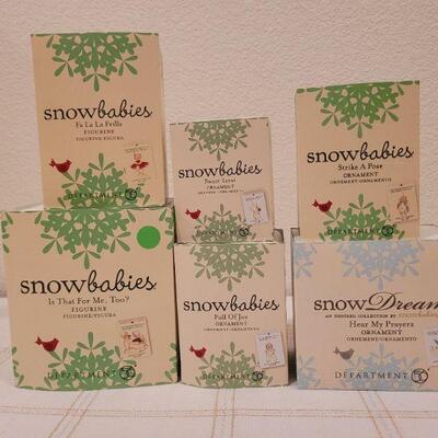 Lot 714: Assorted Dept 56 Snowbabies Christmas Figures 