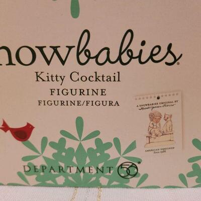 Lot 717: Assorted Dept 56 Snowbabies Christmas Figures + Ornament Stand