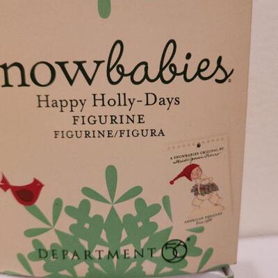 Lot 717: Assorted Dept 56 Snowbabies Christmas Figures + Ornament Stand