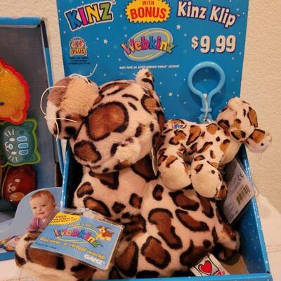 Lot 723: V Tech Rhyme and Discover Tablet + Stuffed Animal and DORA book