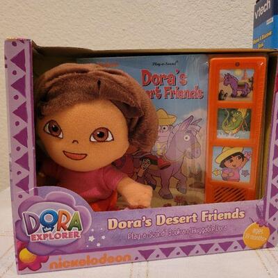 Lot 723: V Tech Rhyme and Discover Tablet + Stuffed Animal and DORA book
