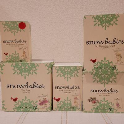 Lot 739: Assorted Dept 56 Snowbabies Christmas Figures 