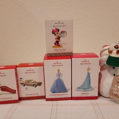 Lot 749: Assorted Hallmark Christmas Ornaments and Deco