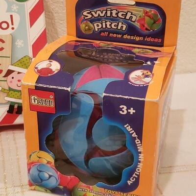 Lot 770:  NEW Gift Lot (Game, Plushie, Activity Pad, Crayons, Toy)