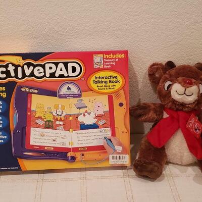 Lot 776: New Interactive Talking Book Active Pad & Reindeer Plushie 