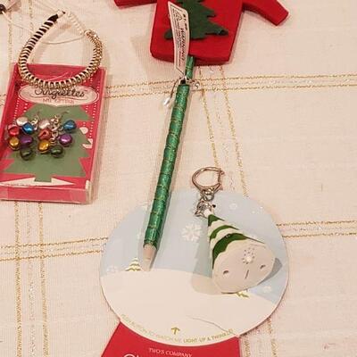 Lot 784:  New Holiday Cheer Lot- Kitty Socks, Lip Balm, Earrings, Bracelet, Pen, Cheer Gear & Santa Wish Box