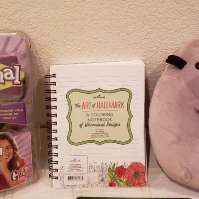Lot 789: NEW Video Journal, Cat Plushie, Coloring book Journal, Colored Pencils & Penguin Hair Decoration