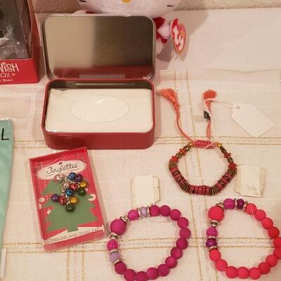 Lot 792: NEW (3) Bracelets, Jingle Bells Earrings, Christmas Dog Socks, Tin with Tissues, Santa Wish Box, HELLO KITTY Plushie