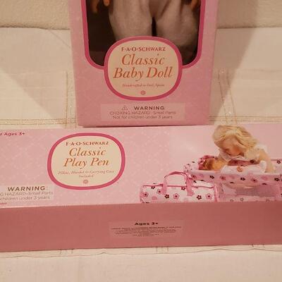 Lot 794: NEW FAO Baby Doll and FAO Doll Playpen 