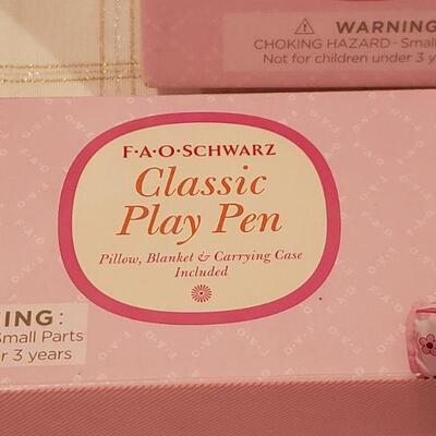 Lot 794: NEW FAO Baby Doll and FAO Doll Playpen 