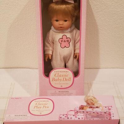 Lot 794: NEW FAO Baby Doll and FAO Doll Playpen 