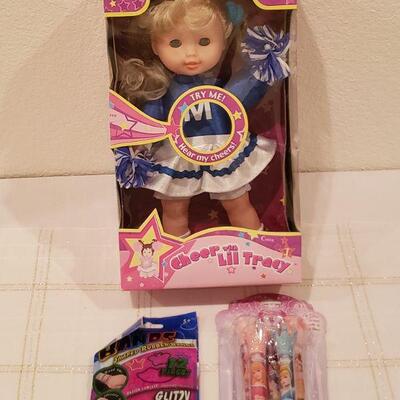 Lot 802: New Cheer Doll, Disney Princess Lip Gloss and bracelets 