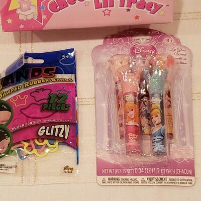 Lot 802: New Cheer Doll, Disney Princess Lip Gloss and bracelets 