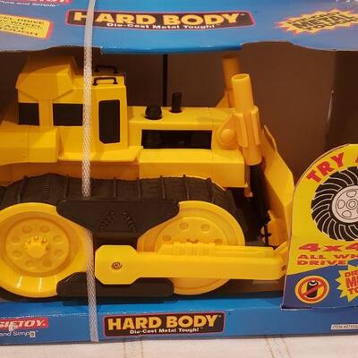 Lot 805: New Tootsie Toy Die Cast Bulldozer and "Jingle" Plushie 