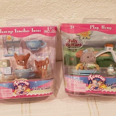 Lot 807: (4) Teacup Families Toys