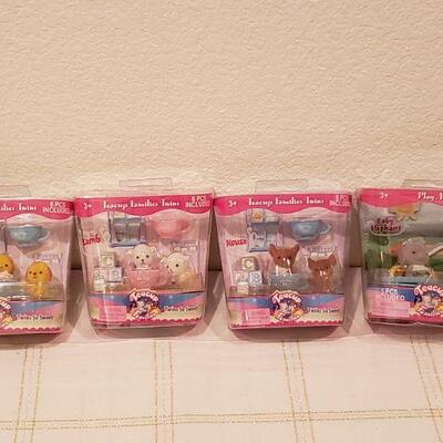 Lot 807: (4) Teacup Families Toys
