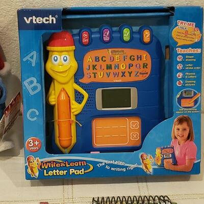 Lot 810: New VTech Toy, Activity Pads and Animated Snowman Plushie 