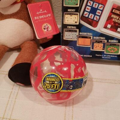 Lot 814: New Video Game, Bouncy Ball, Hot Cocoa Cup and Reindeer Plushie
