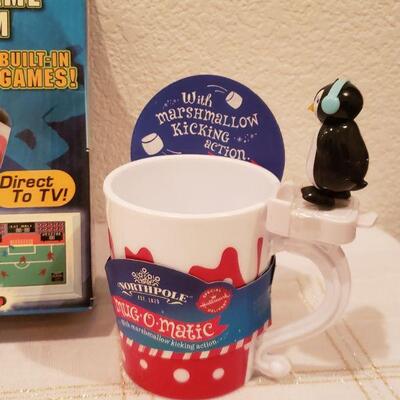 Lot 814: New Video Game, Bouncy Ball, Hot Cocoa Cup and Reindeer Plushie