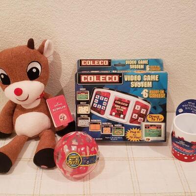 Lot 814: New Video Game, Bouncy Ball, Hot Cocoa Cup and Reindeer Plushie