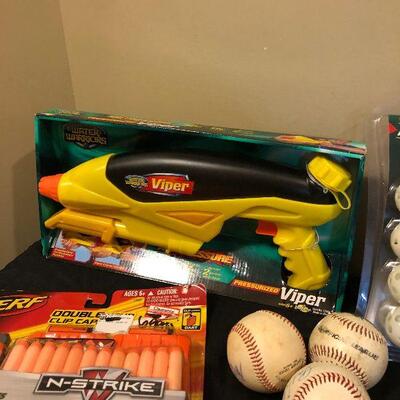 Lot 103 - Large Collection of Sports Items/Toys!  Nerf Guns , Baseballs, Soccer Ball, Tennis Balls, Geyser Blast Sprinkler, Frisbee and...