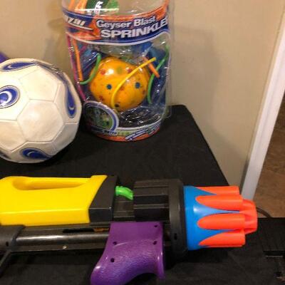 Lot 103 - Large Collection of Sports Items/Toys!  Nerf Guns , Baseballs, Soccer Ball, Tennis Balls, Geyser Blast Sprinkler, Frisbee and...