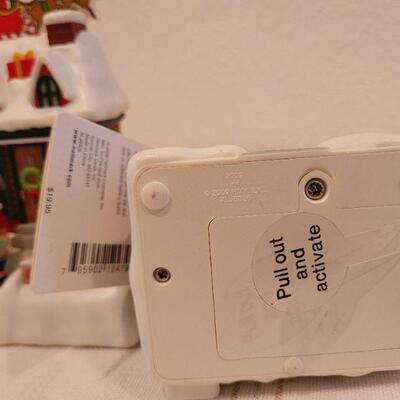 Lot 854: (4) Hallmark Synchronized Christmas Houses TESTED A+