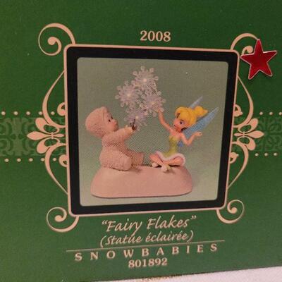 Lot 864: Assorted Dept 56 Snowbabies Christmas Figures and MORE