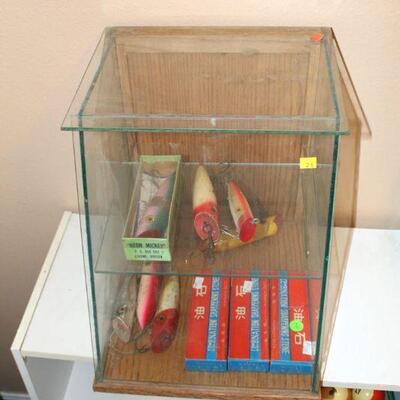 Glass countertop display with vintage lures and sharpening stones (#210)