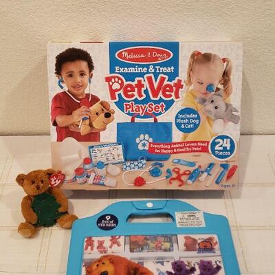 Lot 891: New Melissa & Doug Pet Vet Play Set, Stickers and Soft Ty Beanie Baby Ornament 