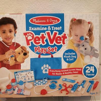 Lot 891: New Melissa & Doug Pet Vet Play Set, Stickers and Soft Ty Beanie Baby Ornament 