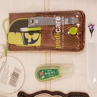 Lot 893: New Chala Cat Coin Purse, Manicure Set, Lip Gloss and Socks