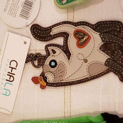 Lot 893: New Chala Cat Coin Purse, Manicure Set, Lip Gloss and Socks