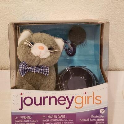 Lot 899: NEW Journey Girls Cat Set, Our Generation Book and Precious Moments Activity Pad