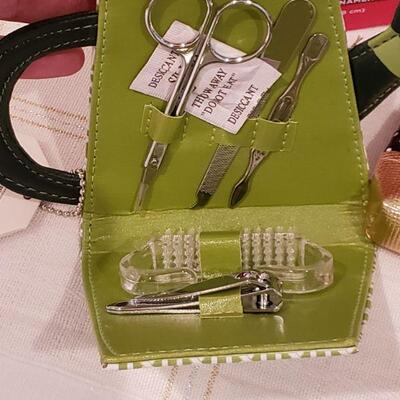 Lot 900: NEW Ornament, Manicure Set, Angel Brooch, Holiday Socks, Lip Gloss, Coin Purse and Yankee Candle Potpourri 