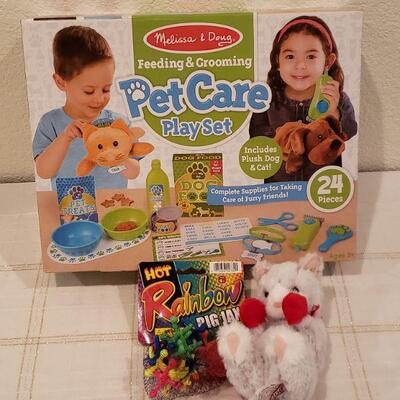 Lot 905: NEW Melissa & Doug Pet Care Play Set, Rainbow Jax and Small Plushie Cat