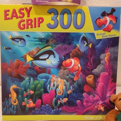 Lot 910: NEW Puzzle, 18" Doll Clothes Set, Lego LED Keychain and Ty Beanie Baby Ornament 