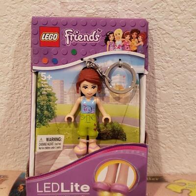 Lot 910: NEW Puzzle, 18" Doll Clothes Set, Lego LED Keychain and Ty Beanie Baby Ornament 