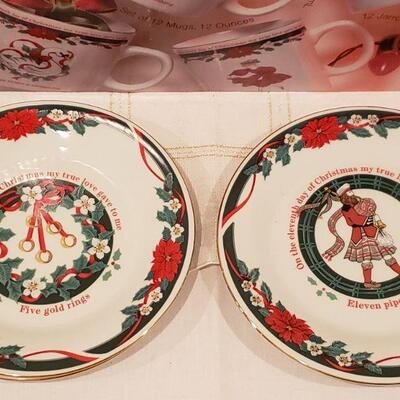 Lot 914: New/Old Stock 12 Days of Christmas Mugs and Dessert Plates- Complete Set of Both