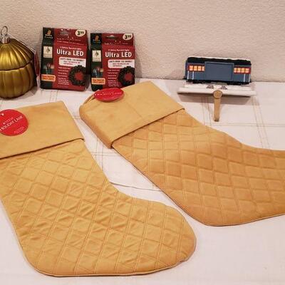 Lot 917: New Macy's Stockings, Polar Express Stocking Hanger, LED Wreath Lights and Candle