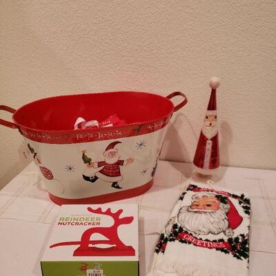 Lot 919: New Holiday Reindeer Nuts, Hand Towels, Glass Light Up Santa and Santa Metal Container